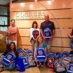 Colliers International and their charitable foundation, Links for Life, partnered to donate more than forty backpacks and hundreds of school supplies.
