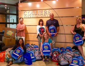 Colliers International and their charitable foundation, Links for Life, partnered to donate more than forty backpacks and hundreds of school supplies.