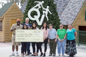 Las Vegas High School students in the JAG Nevada program visited Opportunity Village and presented the organization with a $500 check.