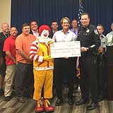 Greater Las Vegas McDonald’s Owner/Operators Association gathered at Las Vegas Metropolitan Police Department Headquarters to present at a check for $10,000.