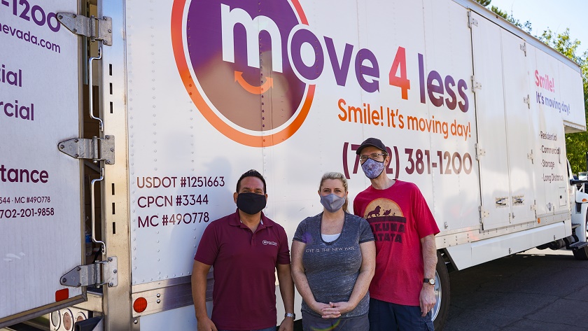 Eyrick Gibson of Move 4 Less (left) with Moving Our Community recipients Michelle and Brian Mell sm-a1ecdaf6